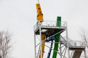 Launch capsule being lifted into place on top of White Water's "KaPau Plummet." 