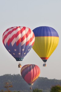 Three of about 20 balloons during their lift off from the Branson Balloon Festival.