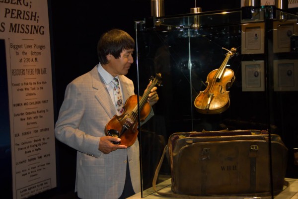 Shoji Tabuchi viewing the  Wallace Hartley Titanic Violin and paying his respects to his fellow musicians who perished that night.